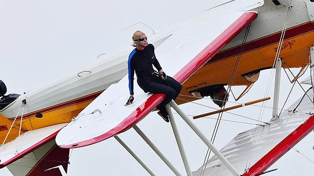 Why do wing-walkers take the big risk?