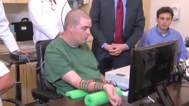 Chip allows paralyzed man to move arm using thoughts