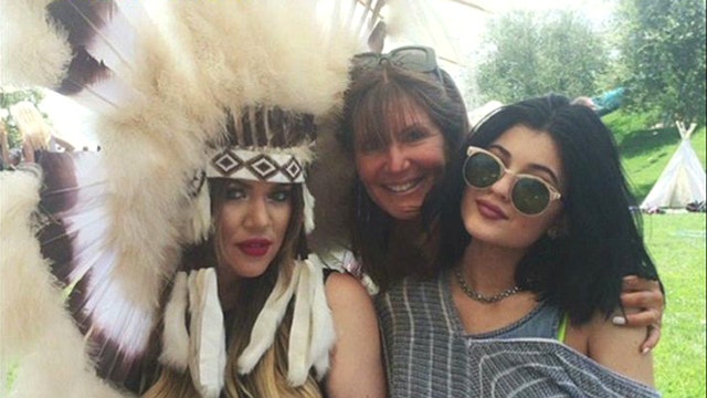 Kardashian ruffles feathers with Native American headdress