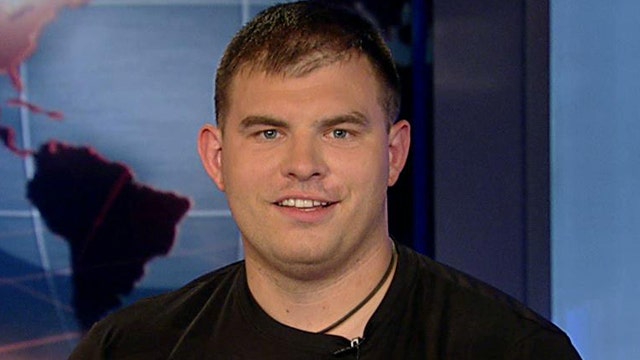 Staff Sgt. Travis Mills sits in the anchor chair on Fox News