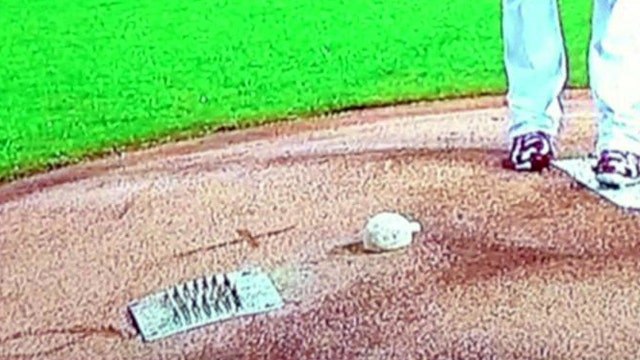 Cross erased from mound in memory of Stan “The Man” Musial
