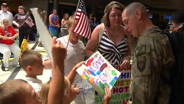 Soldier reunites with family after tour in Afghanistan