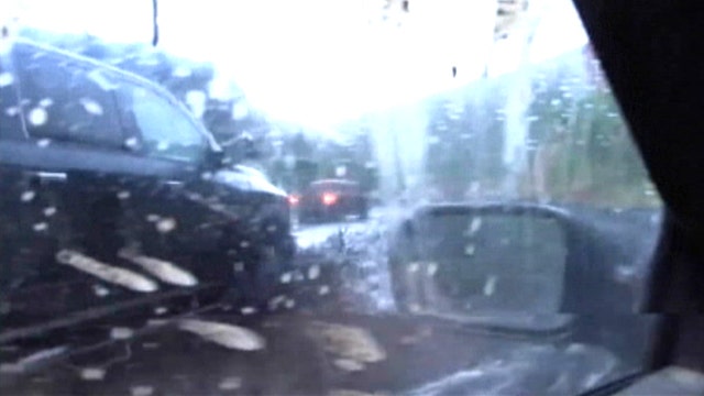 Driver loses control of car during flash flood