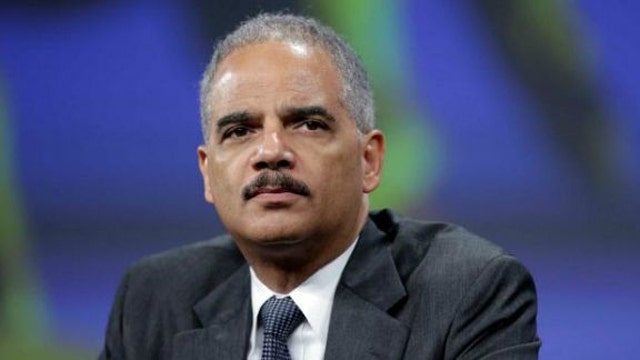 Holder claims racial hostility drives critics of White House