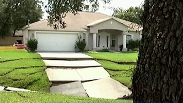 Growing sinkhole continues to swallow homes