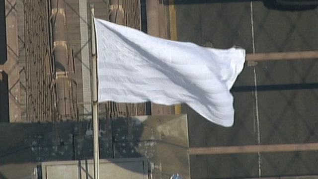Mysterious white flags fly above Brooklyn Bridge