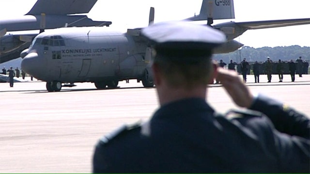 Plane with bodies of MH17 victims arrives in the Netherlands