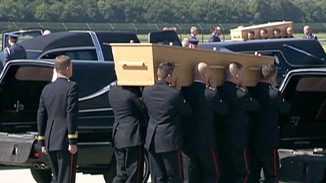 Remains of Flight MH17 victims arrive in the Netherlands