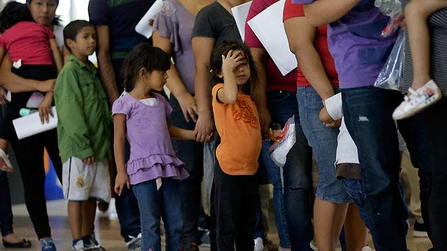 Who's to blame for influx of immigrants kids at US border?