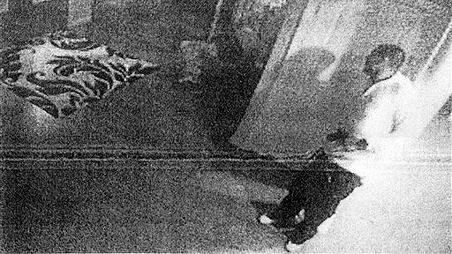 New photos show Hernandez holding gun after murder