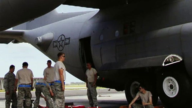 Child's body found in wheel well of US Air Force plane