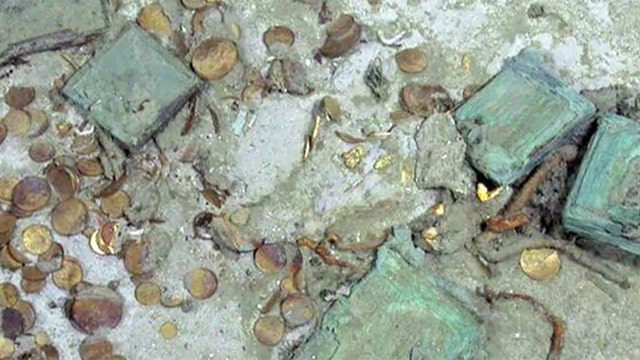 Explorers recover gold, artifacts from shipwreck
