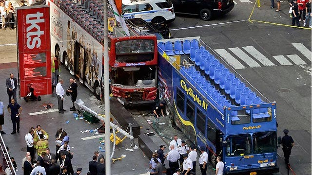 Double-decker tour bus hits second bus in Times Square