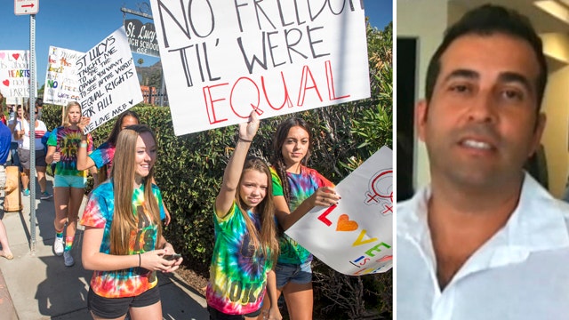 Rally to support gay teacher fired from Catholic school