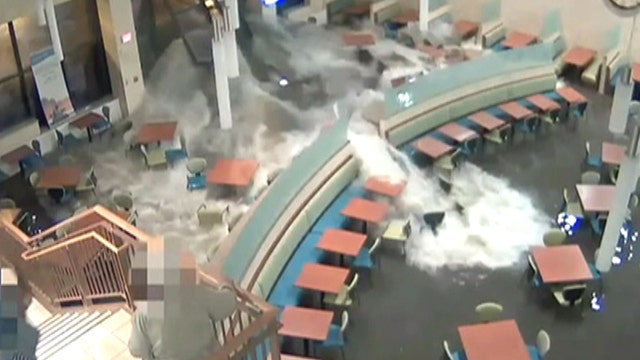 Massive wave of flood waters bursts into hospital