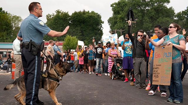 Massive protests spread after cops shoot & kill unarmed teen