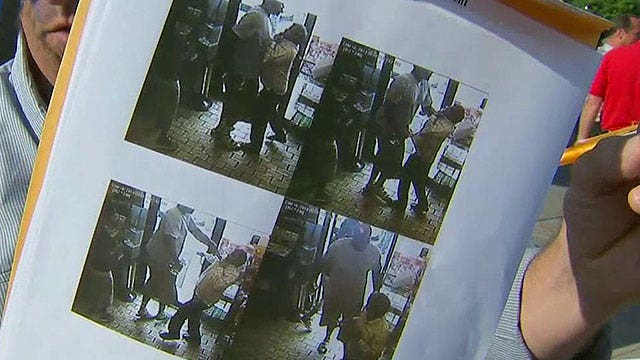 Police release stills of robbery connected to Michael Brown