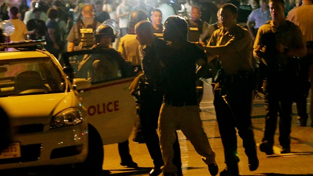 31 arrested, 2 shot as protests turn violent in Ferguson