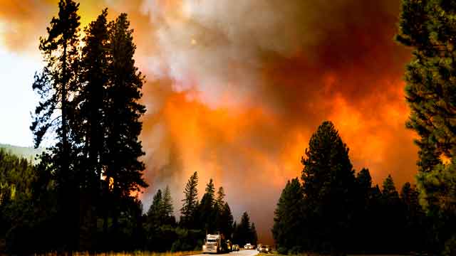 Dozens of Western wildfires burn out of control