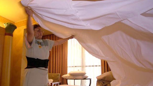 Single men struggle to change the bed sheets