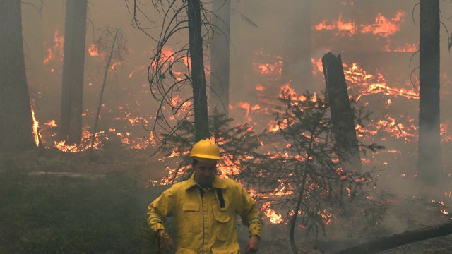 Smoke limiting crews' ability to battle massive wildfire