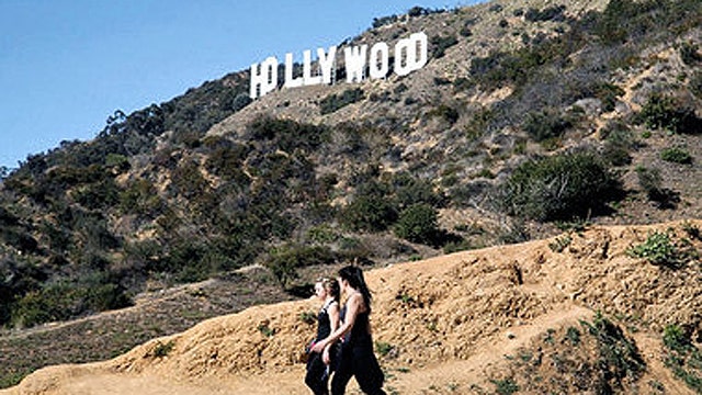 Famous Hollywood sign fun for tourists, headache for locals