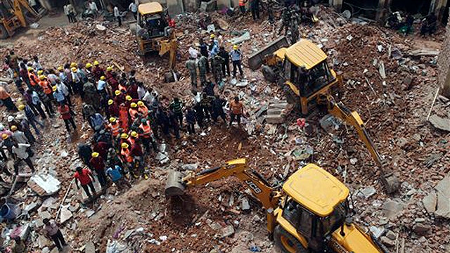 Two buildings collapse in India killing at least 11 people