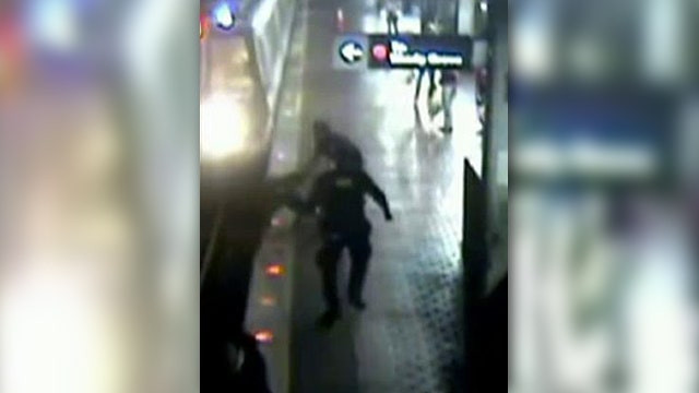 Officers pull man from DC Metro tracks at last second