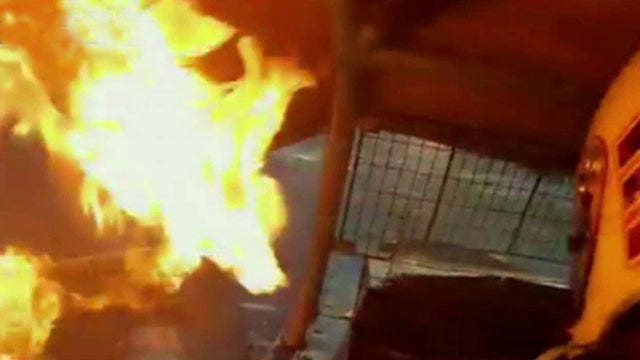 Racecar driver escapes fiery wreck