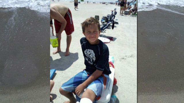 Little boy shakes off shark bite