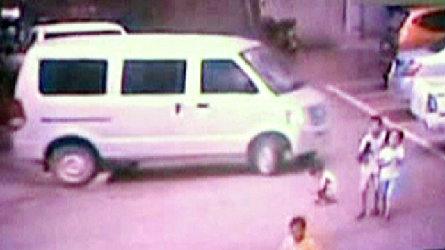 Boy survives after van runs him over in China