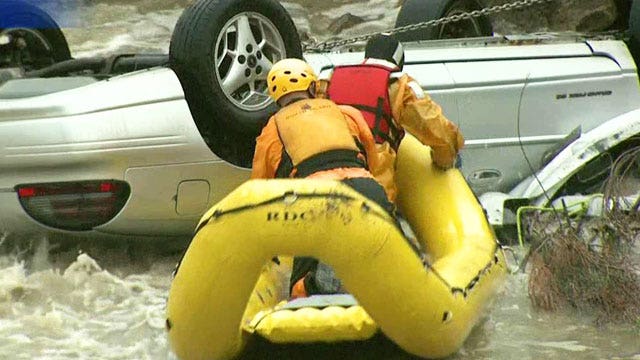 Incredible river rescue of trapped motorist