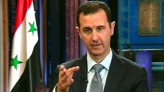 Assad: We want to 'fully' cooperate with weapons agreement