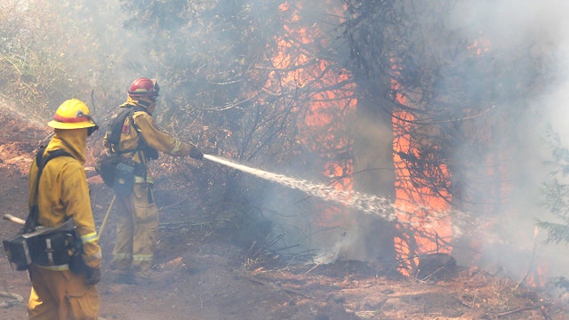 Out-of-control King Fire threatens thousands of homes
