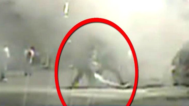 Daring rescue caught on tape: Cops pull man from burning car