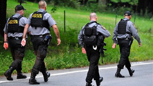 Police searching woods for PA trooper shooting suspect