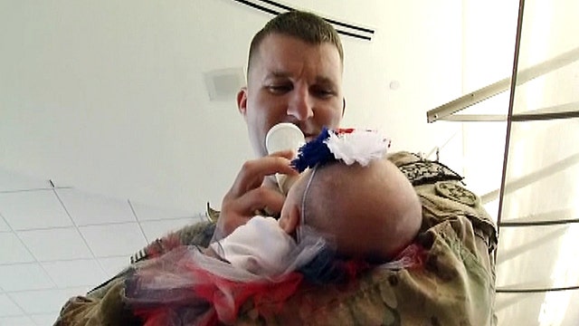 Soldier meets his baby for first time