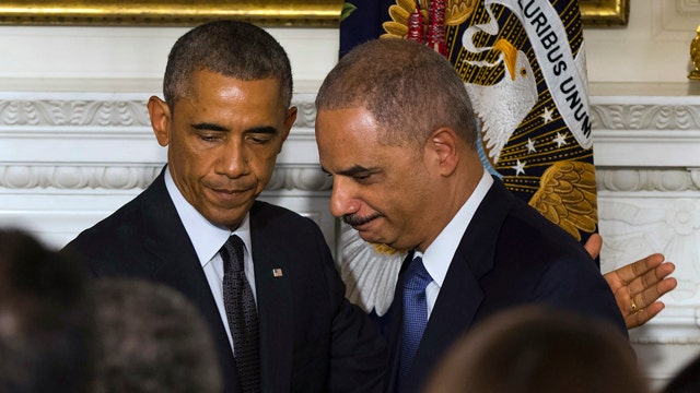 Rep. Darrell Issa reacts to Eric Holder's exit