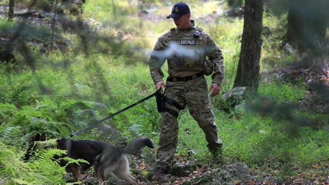 Terrain, bears present challenges in search for cop killer
