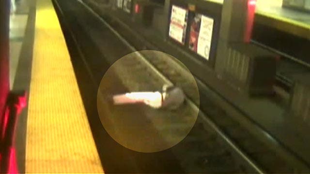 Man falls on train tracks