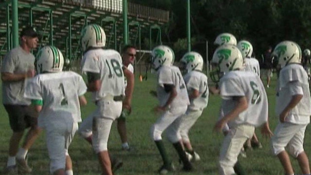 Study: Young football players taking adult-size hits