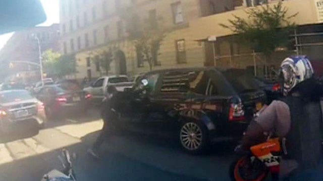 Biker arrested after beating man he pulled from SUV