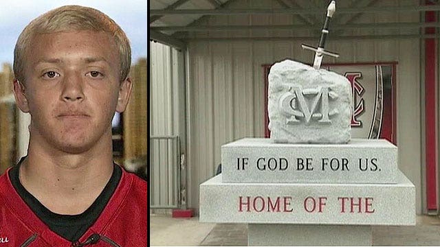 Atheists want school statue with bible verses removed