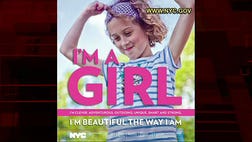 >Encouraging ads posted on buses