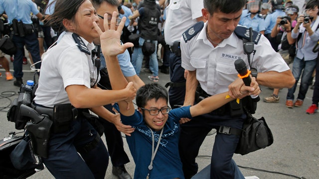 Beijing says Hong Kong protests 'doomed to fail'