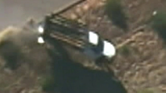 Armed bank robbery suspect goes airborne while fleeing cops