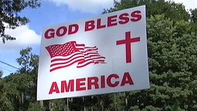 Florida town cracks down on 'God Bless America' signs