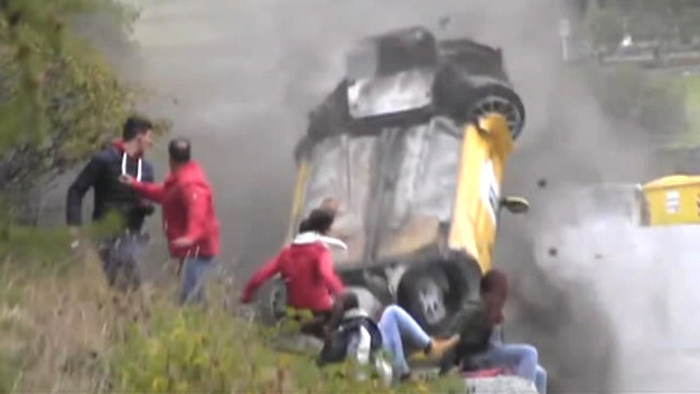 Spectators cheat death as racecar flips, crashes into crowd
