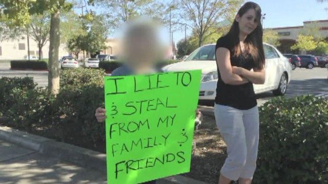 Girl wears sign of shame as punishment