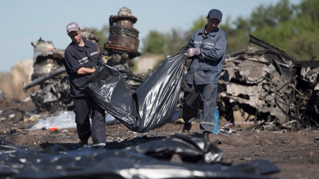 Questions raised by MH17 victim found wearing oxygen mask